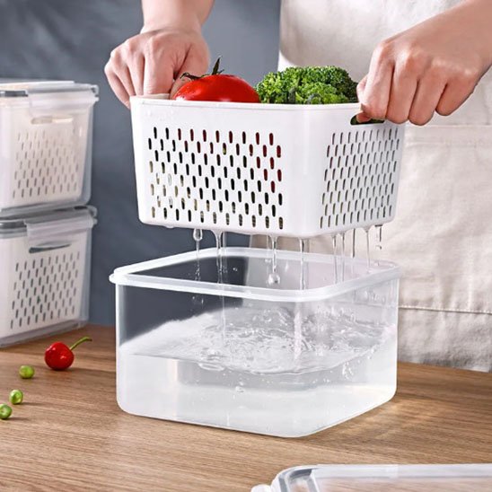 Boite alimentaire avec égouttoir intégré